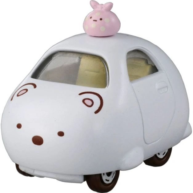 White toy car with cartoon face and pink bunny on top.