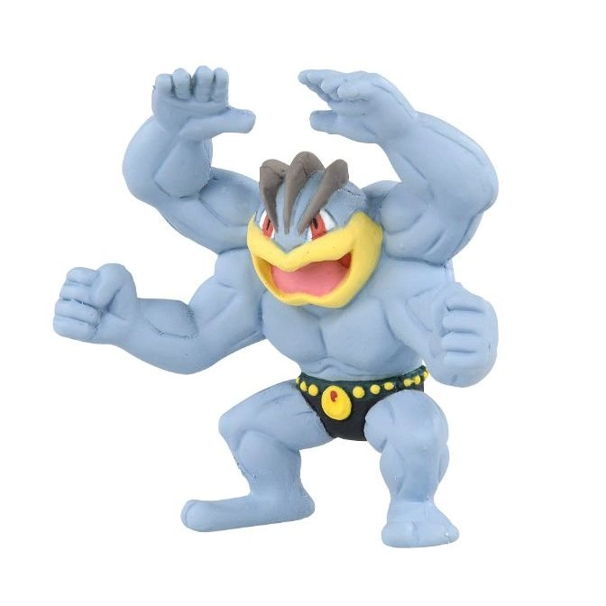 Machamp toy figure with four arms, yellow face, and black wrestling trunks.