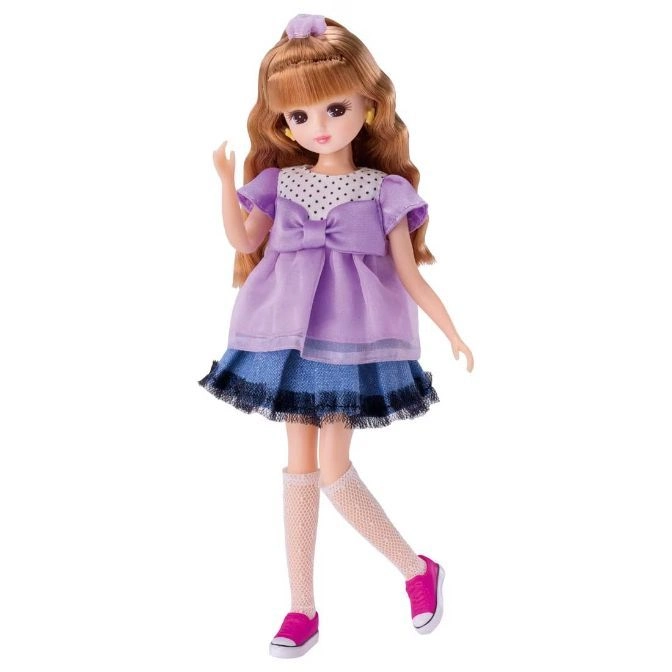 Doll with auburn hair in a purple dress, denim skirt, knee socks, and pink sneakers.