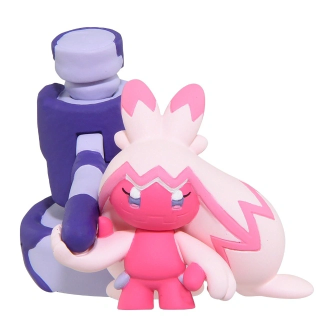 Two toy figures: a purple robot and a pink creature with rabbit ears and long hair.