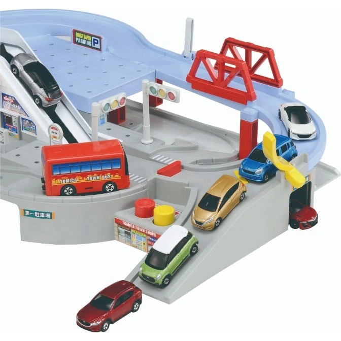  Toy car park with cars, bus, bridge, and ramps. "BUSTOWN PARKING" sign visible.