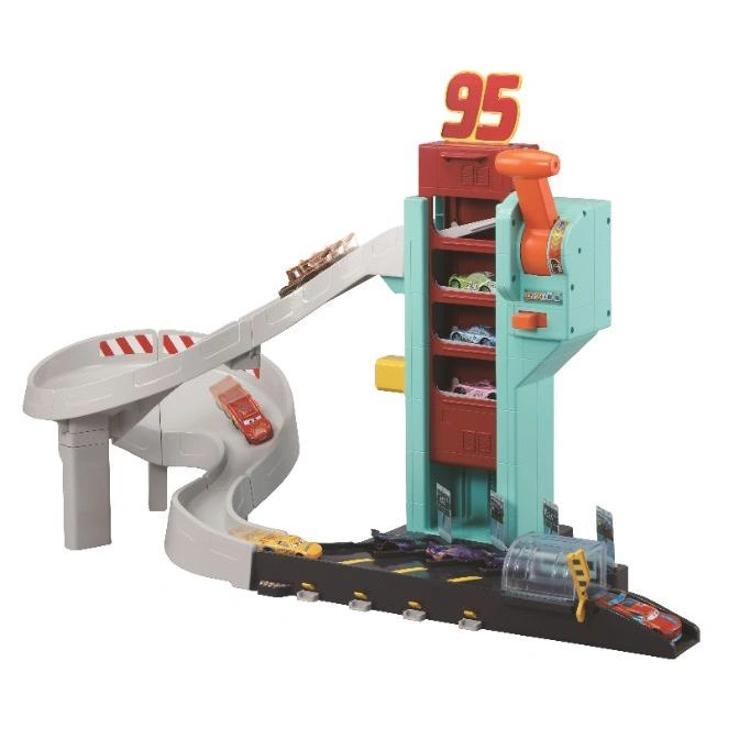  Cars playset with spiral ramp, elevator, and multiple toy cars on a black track.