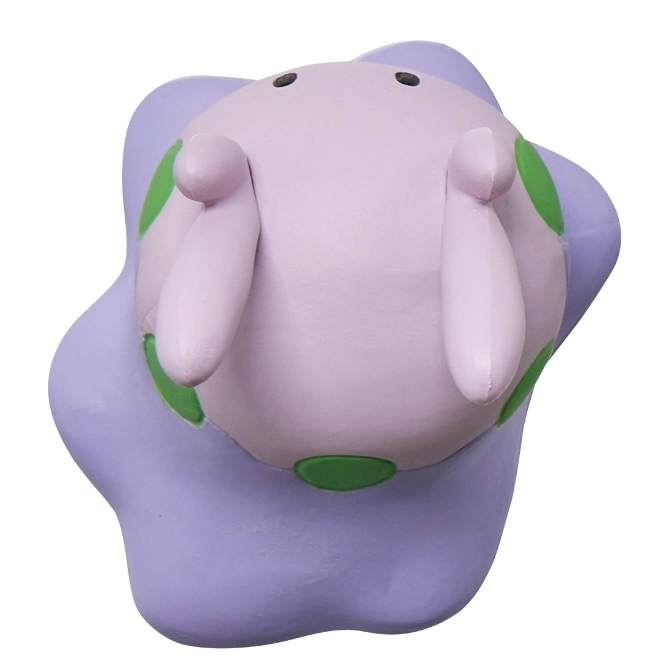  Purple clay toy with green spots and two arms.