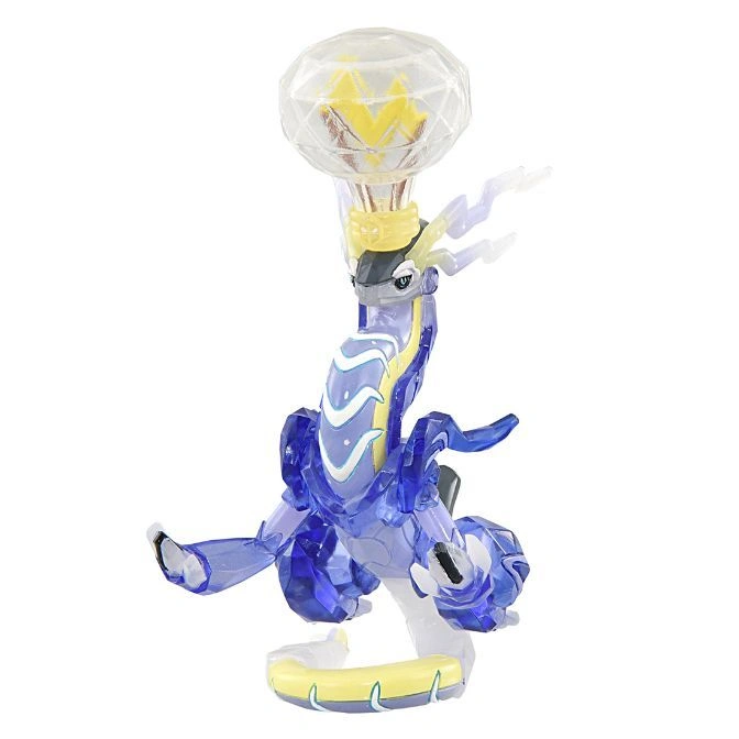 Translucent blue dragon toy with a clear orb on its head, standing on a yellow base.