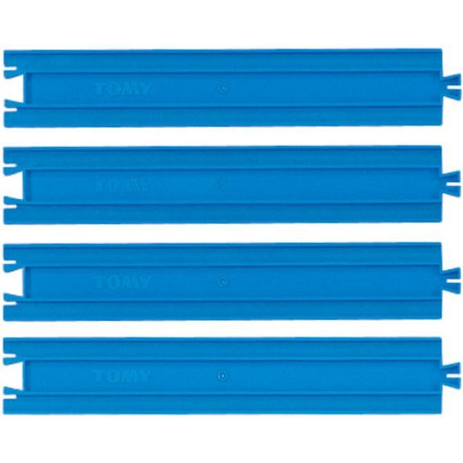 Four blue Tomy train tracks are stacked on top of each other.