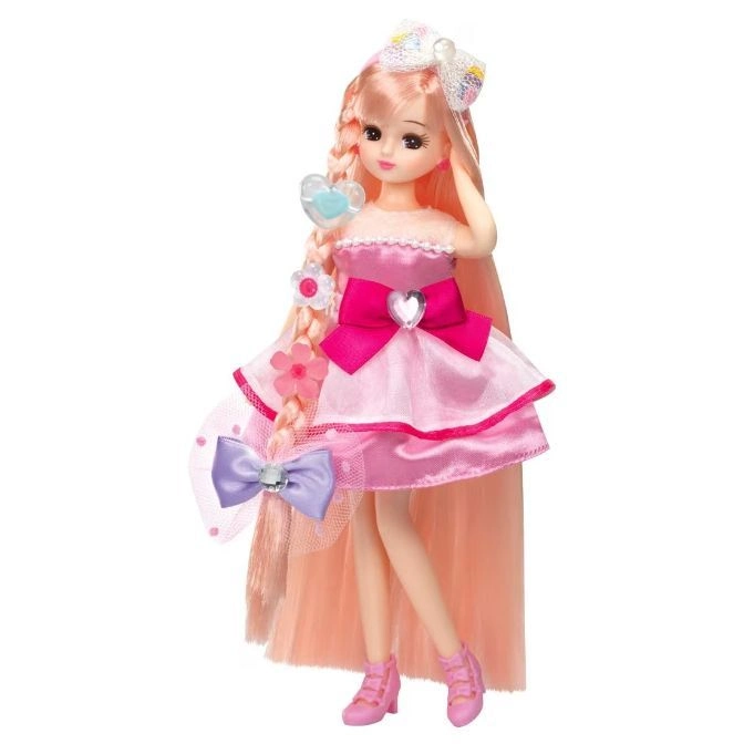 Pink-haired doll in a pink dress with bows and matching shoes.