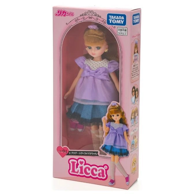  Licca doll in box: blonde hair, purple dress with blue skirt. "Licca" logo visible.