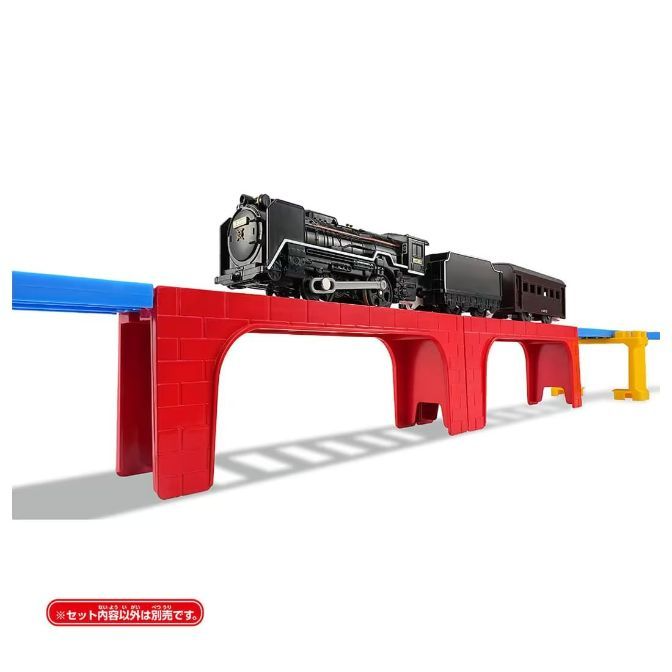  A toy train set featuring a black steam engine and passenger car on a red bridge with blue and yellow track pieces.