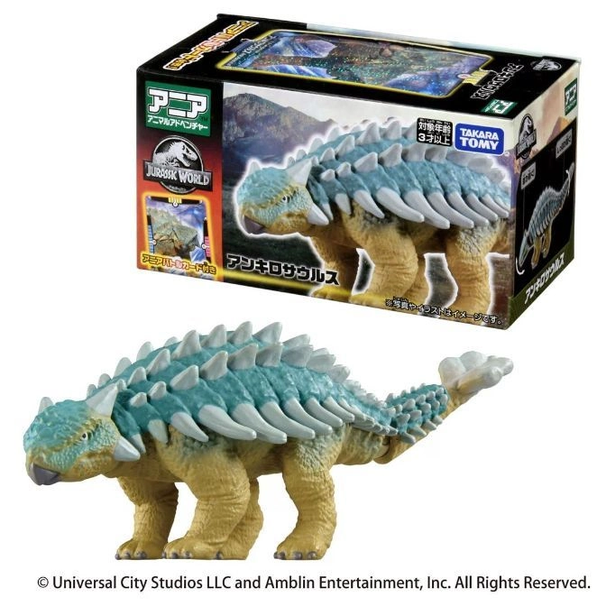 Ankylosaurus toy with blue armor plating and a club tail, next to its packaging.