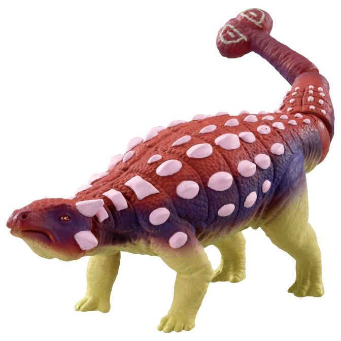 Ankylosaurus toy with red and purple armor plating and a clubbed tail, standing on yellow legs.
