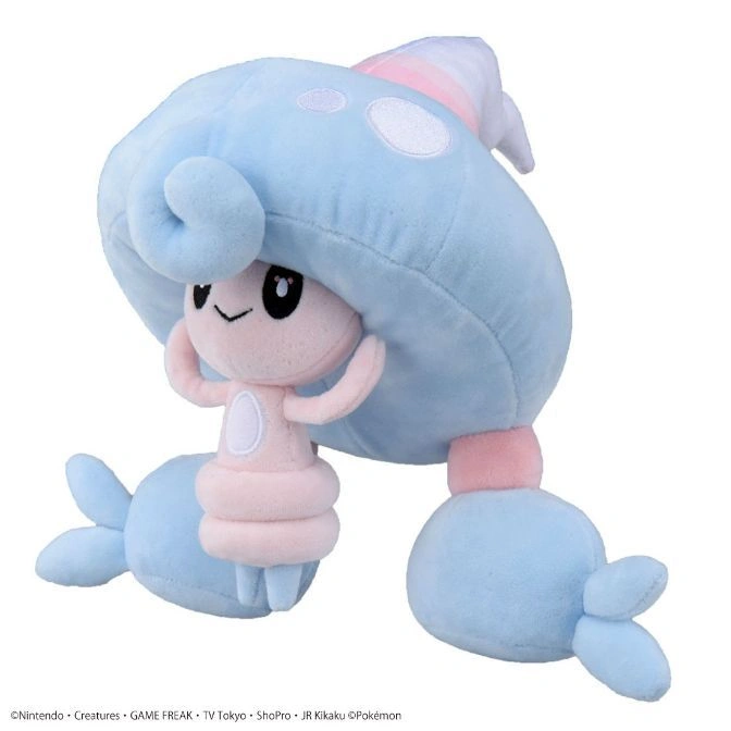 Light blue and pink Lurantis plush toy with a smiling face and curled arms.