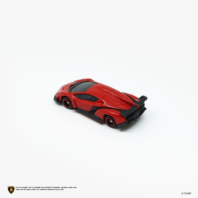  Red toy Lamborghini with black accents on a white background.