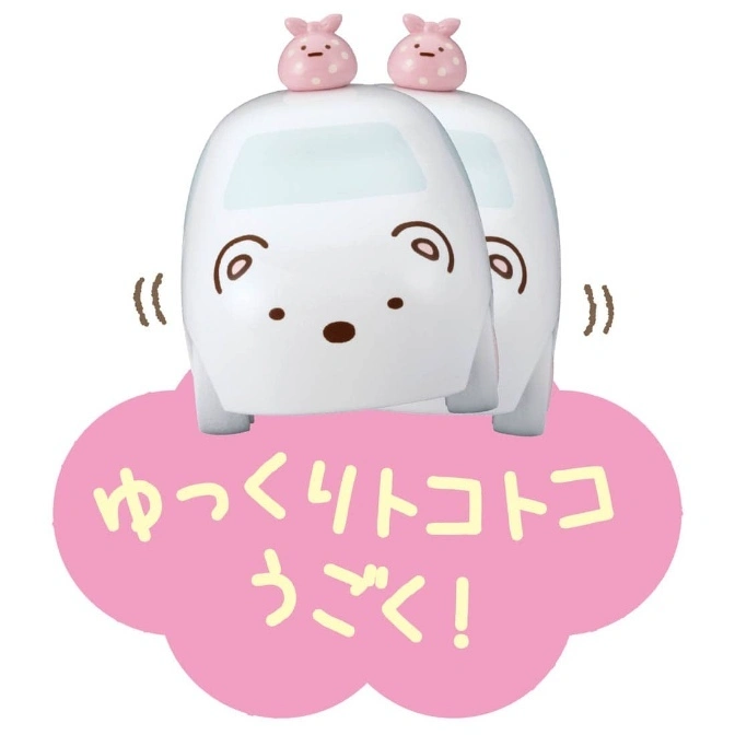  Two white toy cars with pink bunny figures on top, resting on a pink cloud with Japanese text.