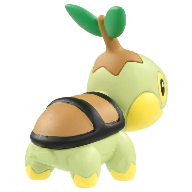  Turtwig toy figure with green body, brown shell, and plant sprouting from its head.