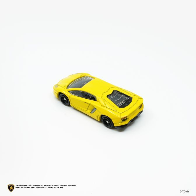  Yellow toy Lamborghini Aventador with black wheels on a white background.