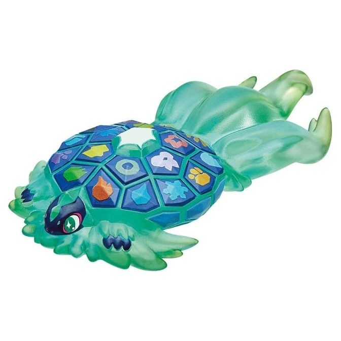 Translucent turquoise turtle toy with colorful icons on its shell and flowing tail.