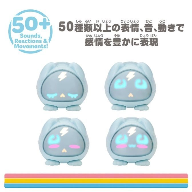  Four blue interactive toy figures with light-up faces and a rainbow-colored base.