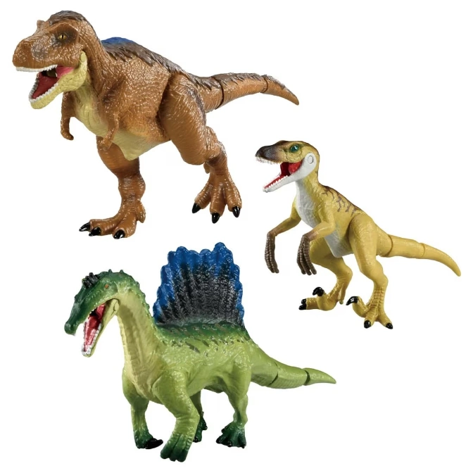 Three dinosaur toys: a brown T-Rex, a yellow raptor, and a green Spinosaurus with a blue sail.