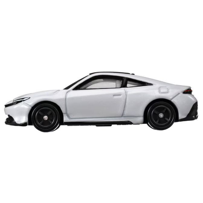  White toy coupe with black wheels and trim, showcasing a sleek, sporty design.