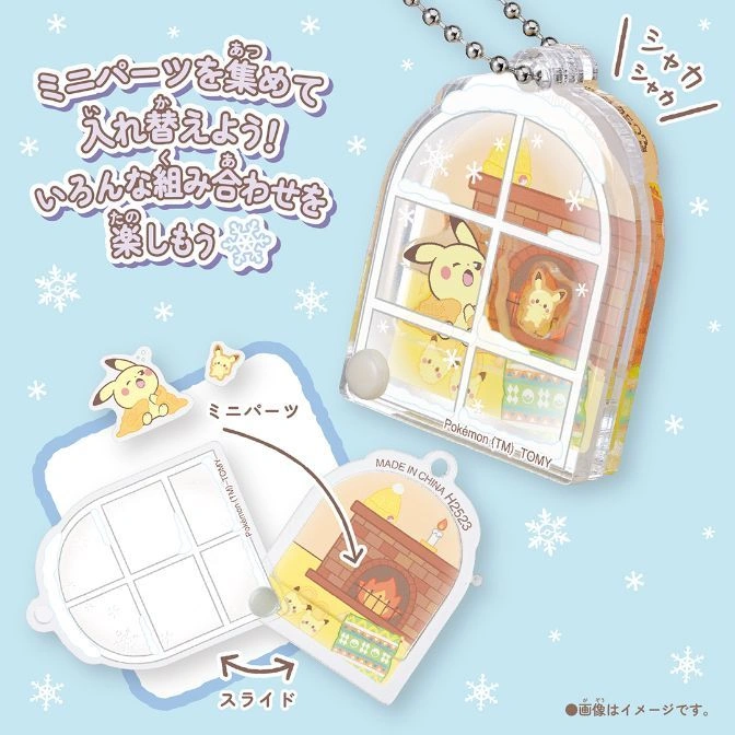  Pichu window toy with changeable parts. Slide to change scenes. "Pokémon TOMY" printed on toy.