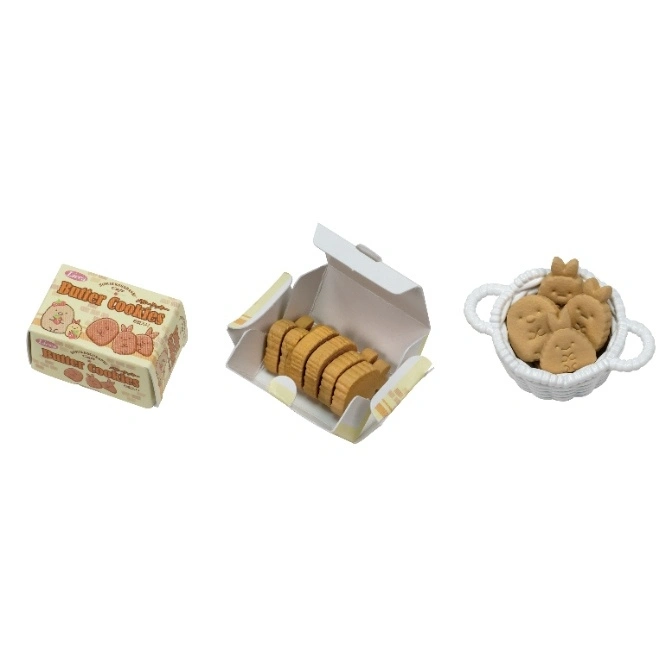  Miniature toy cookies: boxed slices, a basket of character shapes, and a butter cookie package.