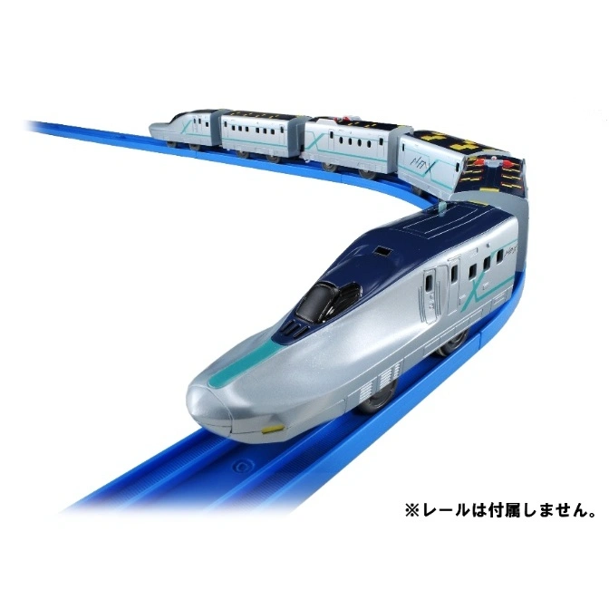 Toy bullet train on blue tracks, silver with blue accents, multiple cars.