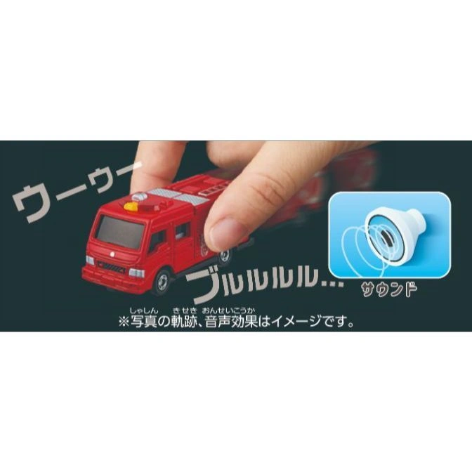  Red toy fire engine with sound effects, being pushed by a hand.