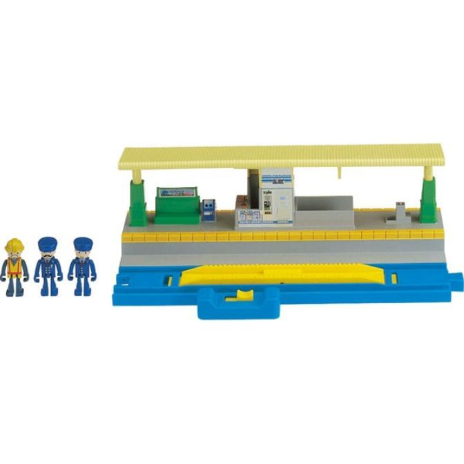 Toy train station with three figurines