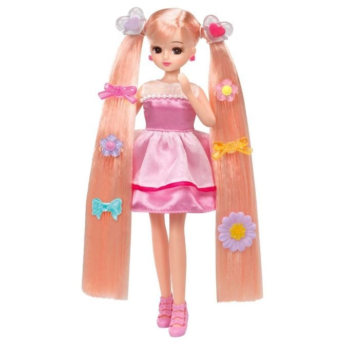  Doll with pink hair, dress, and shoes, adorned with flower and bow accessories.