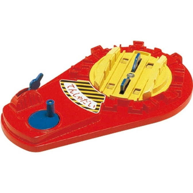 Red and yellow toy train turntable with levers and tracks.