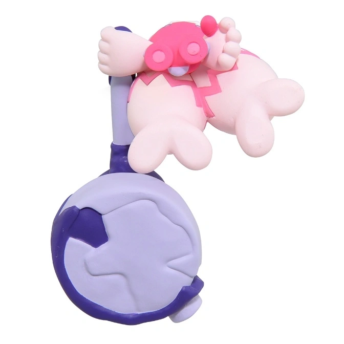  Pink and purple toy figure with a cracked egg and a character with pink goggles.