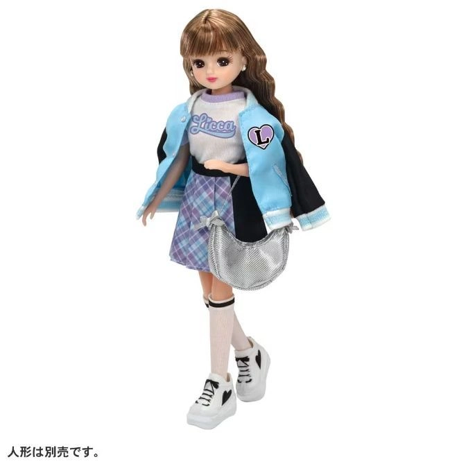  Licca-chan doll in a varsity jacket, plaid skirt, and sneakers with a silver purse.