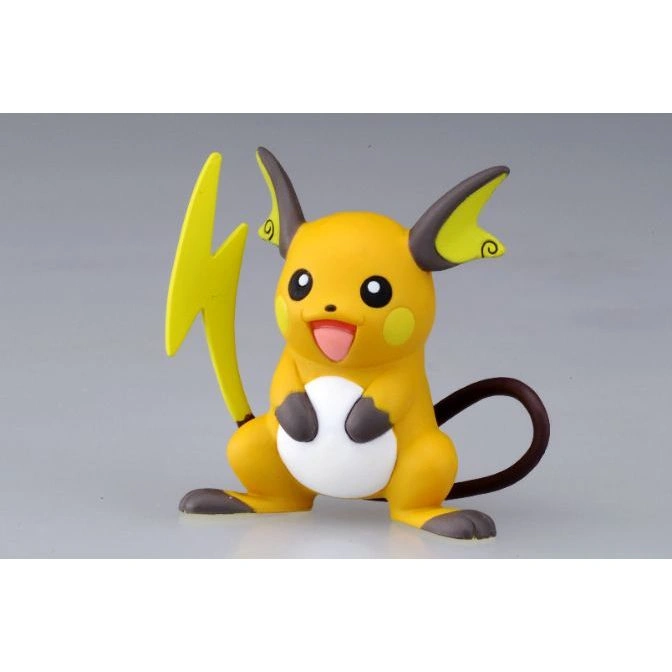 Raichu figurine holding a white ball, with a lightning bolt tail and brown-tipped ears.