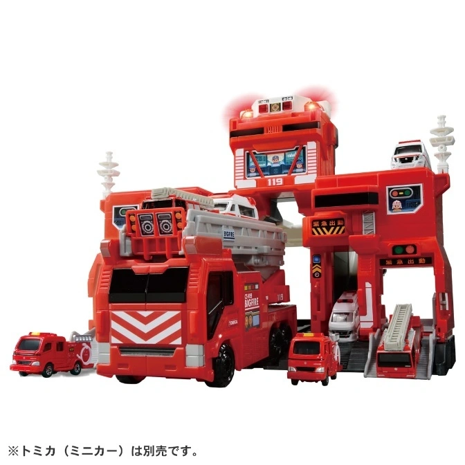 Red Tomica Big Fire Station playset with toy fire trucks.