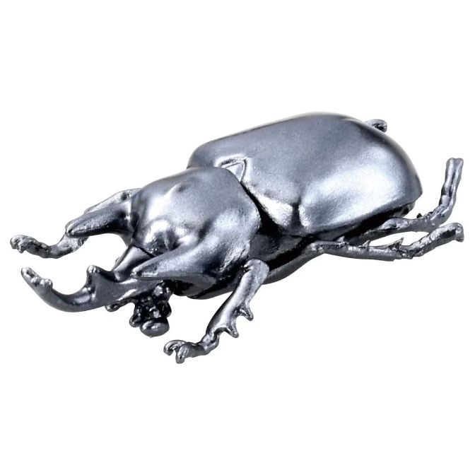  Silver beetle toy with prominent mandibles and textured legs.