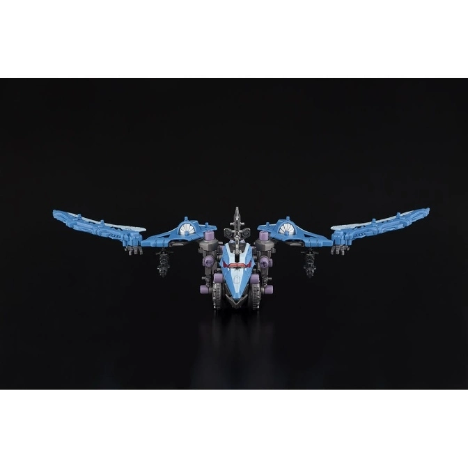  Blue and purple winged transformer toy with guns, wings spread.