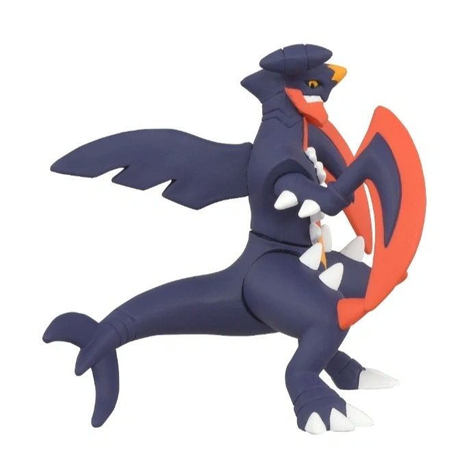  Garchomp toy figure with wings, orange neck, and shield-like arm attachment.