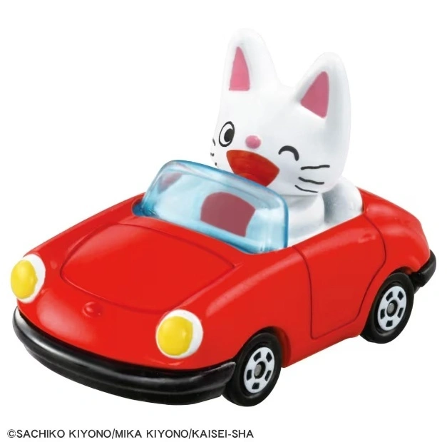 Toy car with a white cat figure driving. Red convertible with yellow headlights.