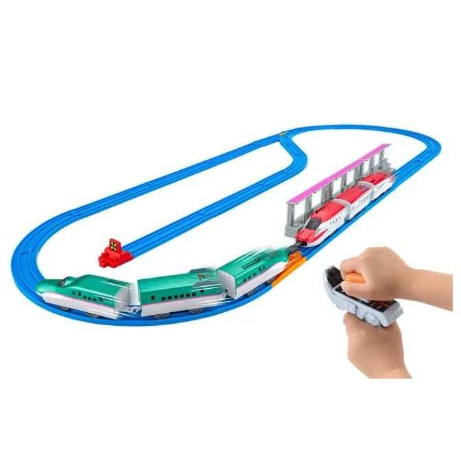 Toy train set with two trains on a blue track.