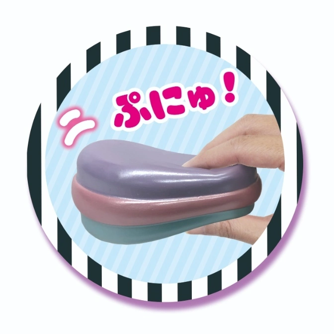  Stackable squishy toy being squeezed by a hand, inside a striped circle.
