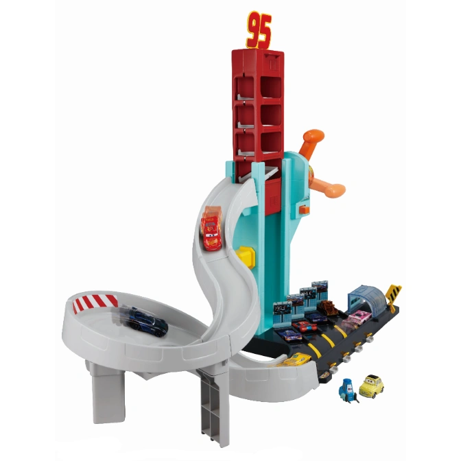  Cars playset with spiral ramp, tower, and multiple toy cars on a track.