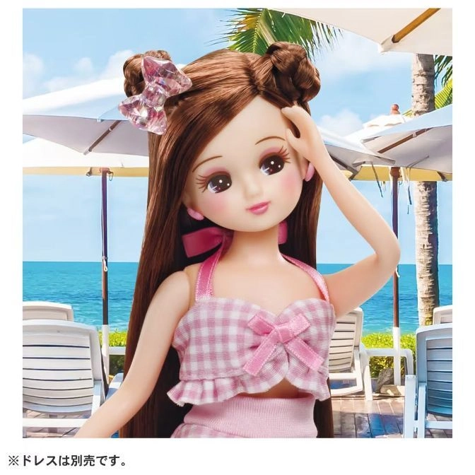  Licca-chan doll in pink gingham swimsuit at the beach, with hair in buns and a bow.