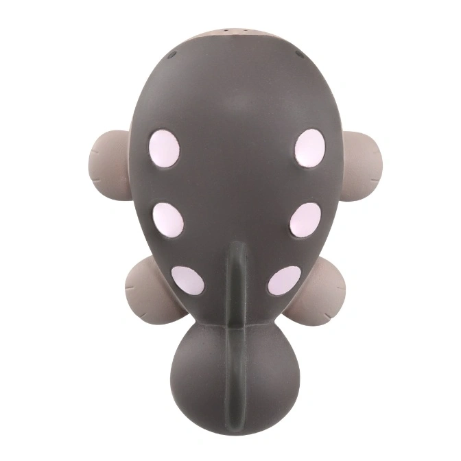  Grey manatee toy with pink spots and small flippers.
