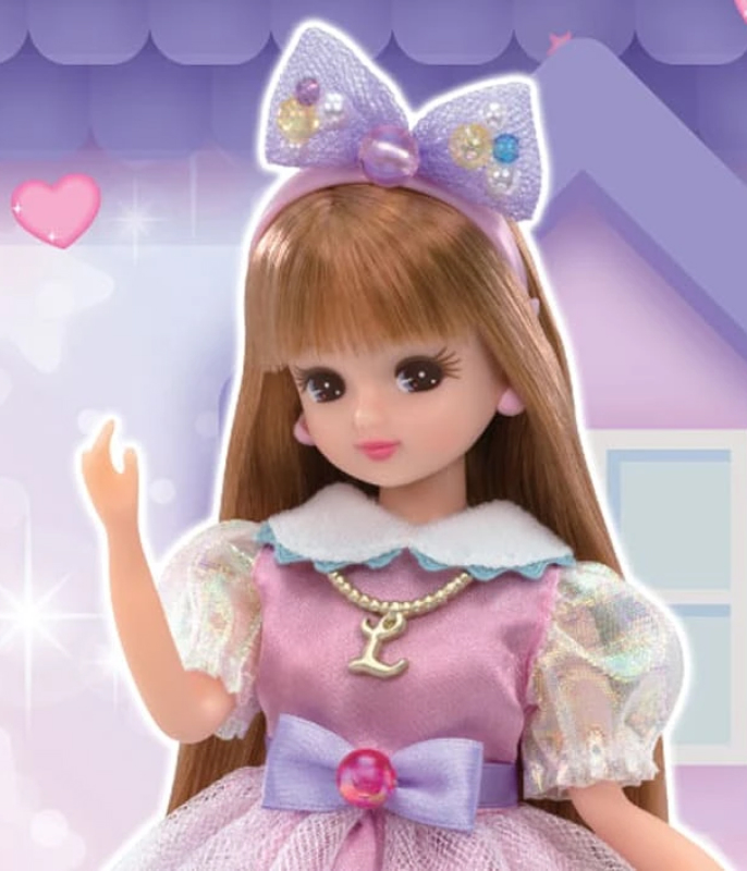Licca doll in purple dress with jewelled bow headband.