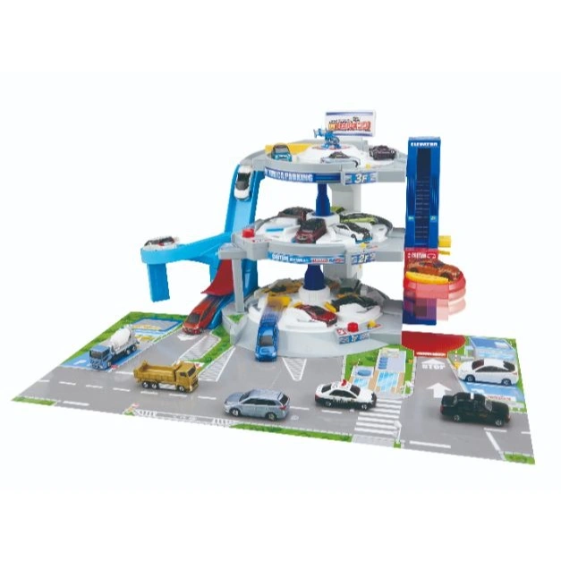 Tomica parking garage toy with multiple levels, elevator, ramps, and toy cars on a playmat with roads and buildings.