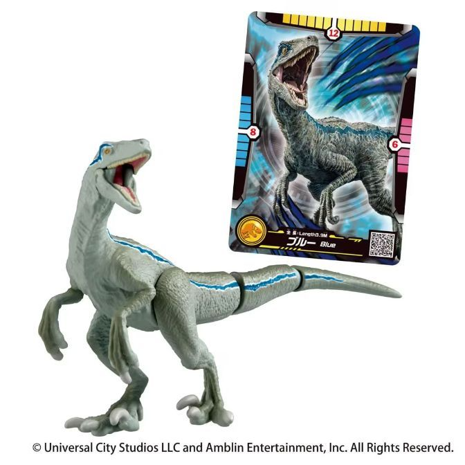 Blue the velociraptor toy with trading card. Dinosaur figure with blue stripe.