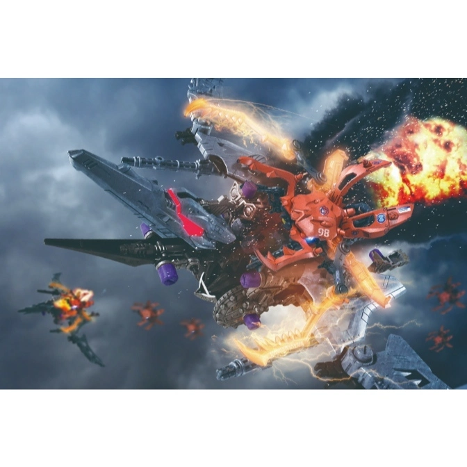  Orange and grey transforming robot toy with weapons firing and explosions in a cloudy sky.