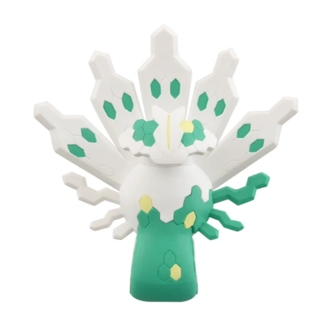 White and green Zygarde Core toy with hexagonal patterns and tail-like appendages.