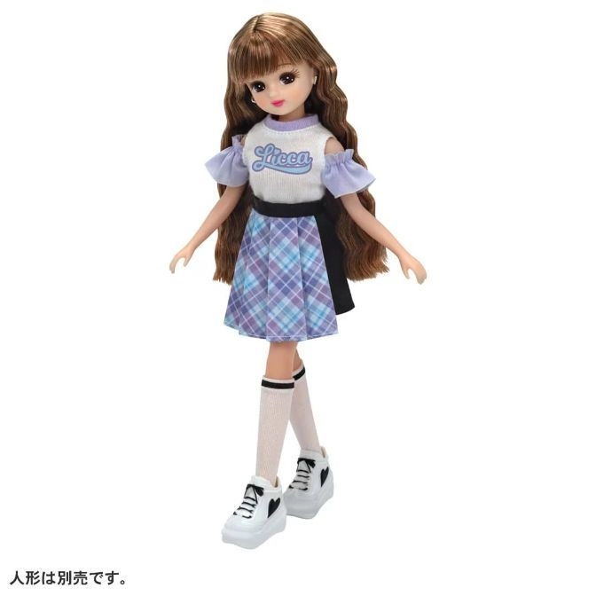 Licca doll with brown hair, wearing a plaid skirt, white top, knee socks, and white platform sneakers.