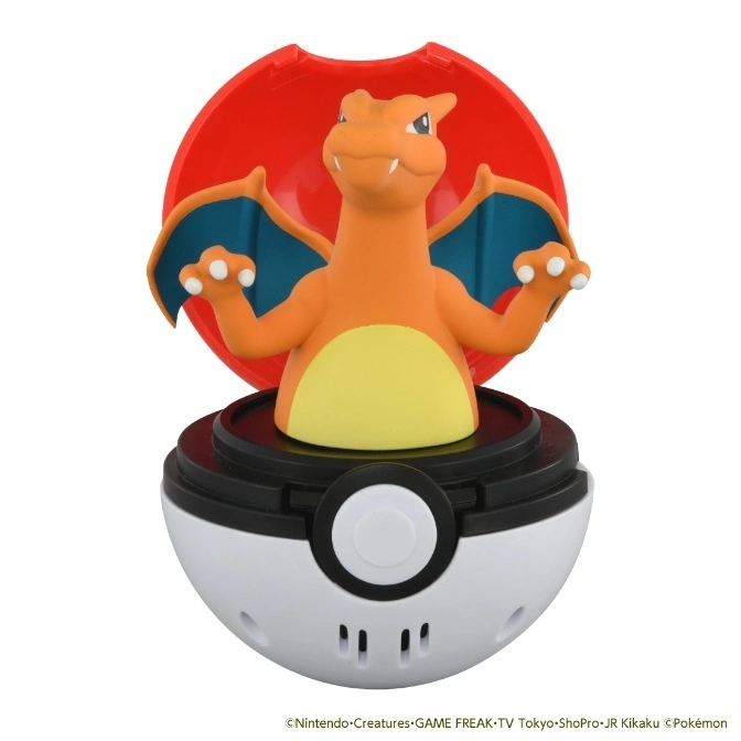 Charizard toy emerging from an open Poké Ball, wings spread, ready for action.